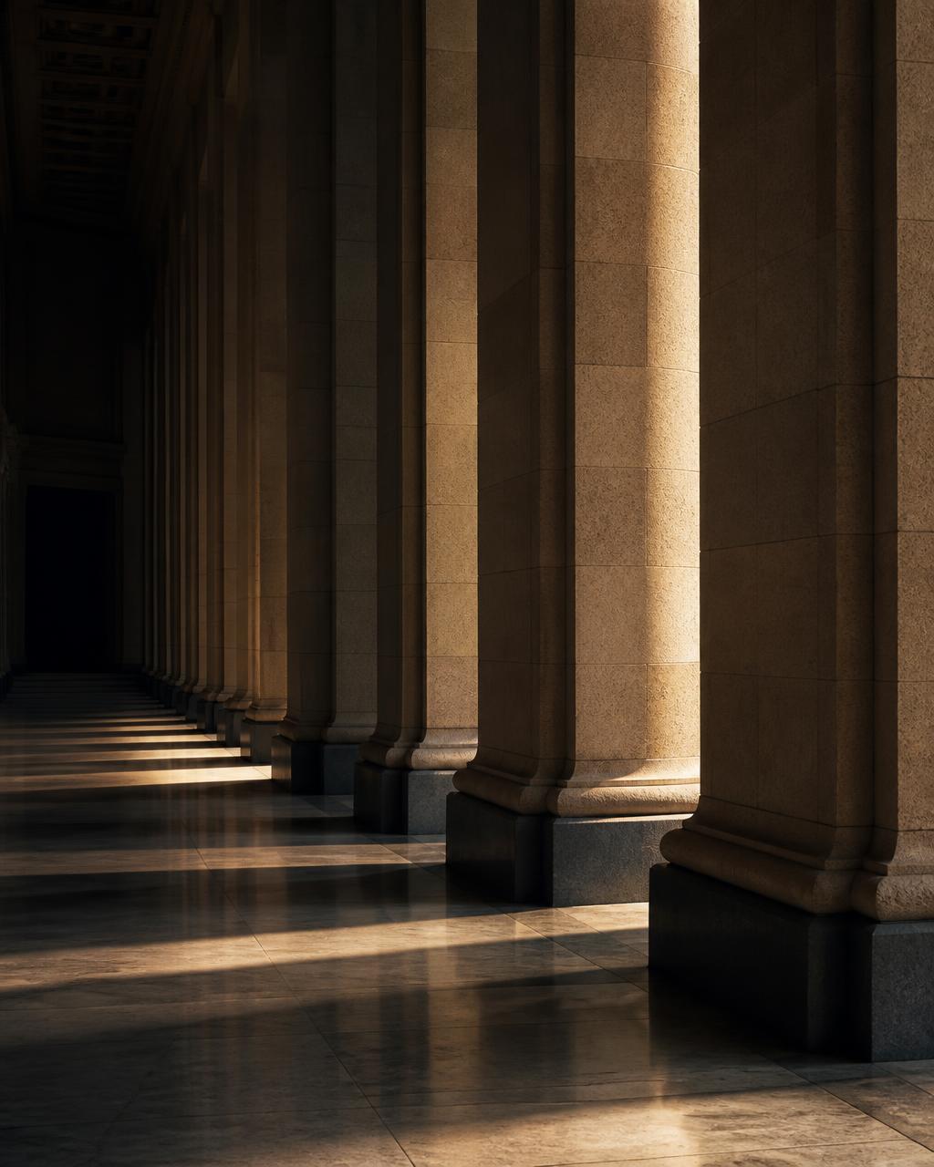 Stone colonnade in low raking daylight