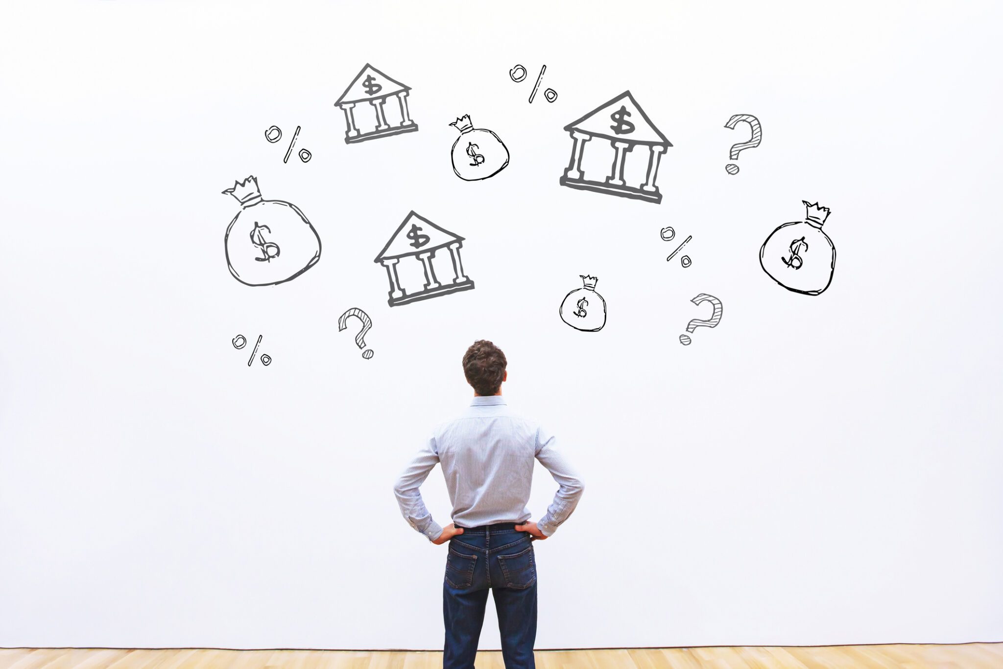 Man looking at a mural with financial drawings