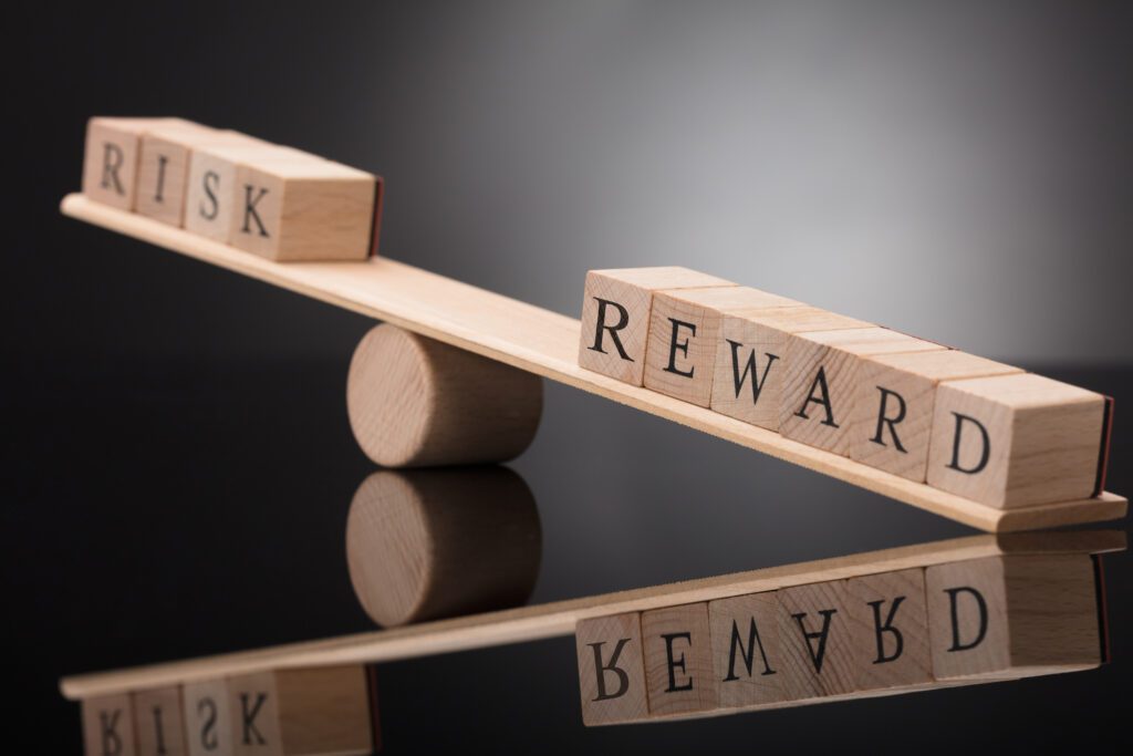 Image of a seesaw with dice on both sides